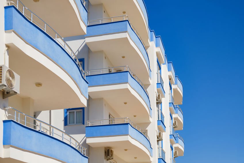 Blue and white multi storey residential building. Modern apartment building